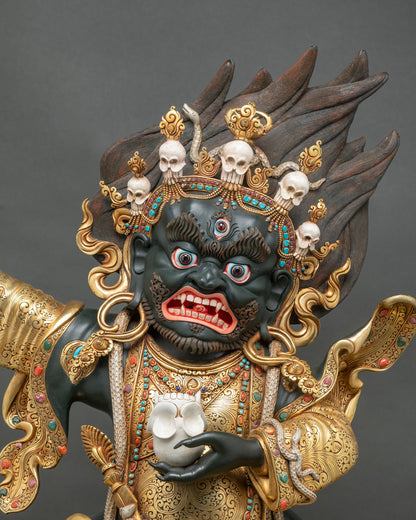 Close-up of Black Cloak Mahakala Bernagchen with five-skull crown, skull cup and gold carved robes