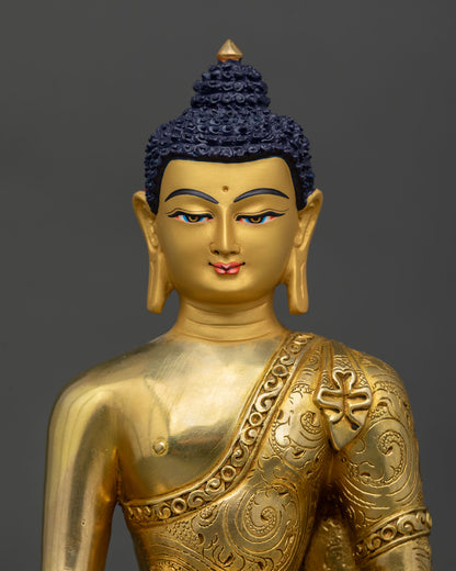 Close up of Buddha face with 24K gold gilded finish and serene enlightened expression