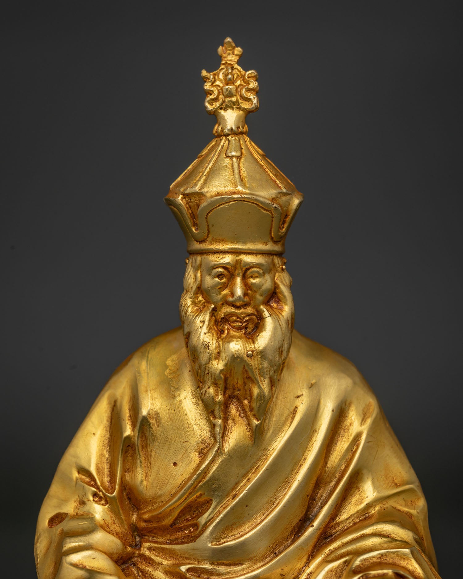 Close Up of Chatral Rinpoche Statue with White Beard and Jeweled Crown.