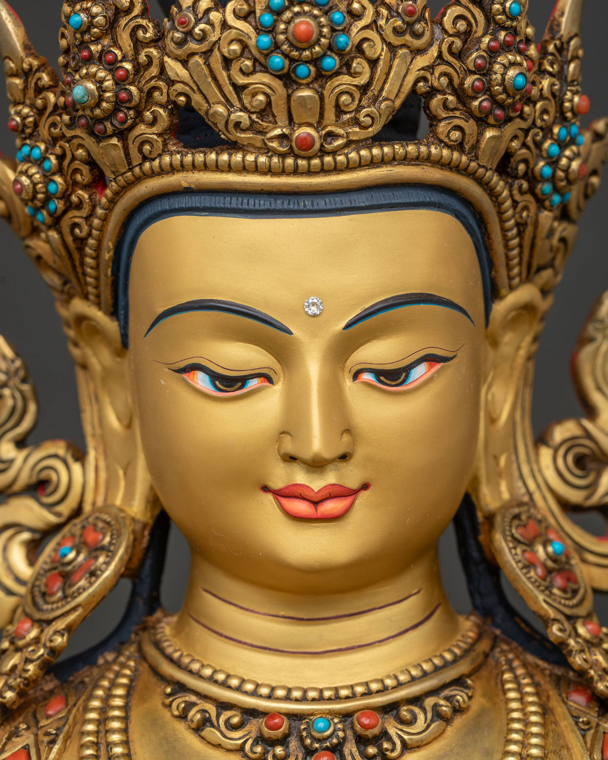 Close-up of handcrafted Chenrezig statue, 24K gold fire-gilded copper details