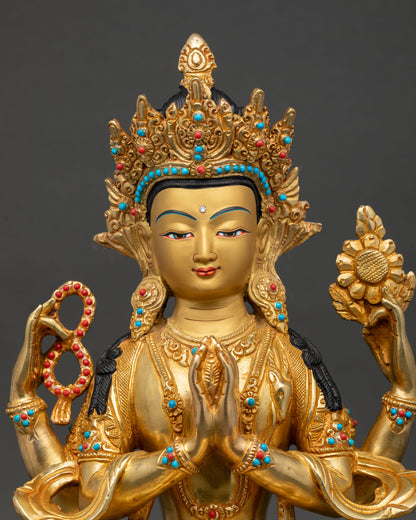 Close up of Chenrezig four armed Bodhisattva showing serene face gold detailing and intricate Himalayan craftsmanship