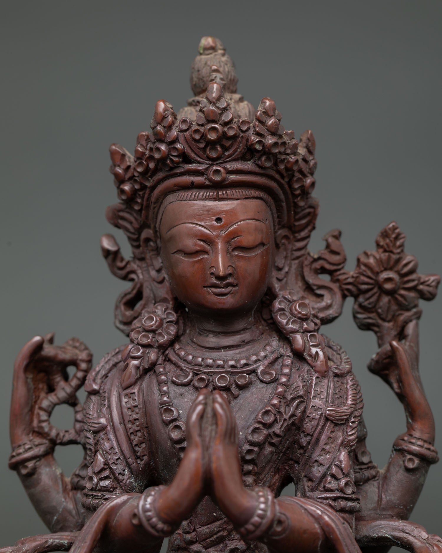 Close Up of Chenrezig Holding Wish Fulfilling Jewel with Rosary Mala.