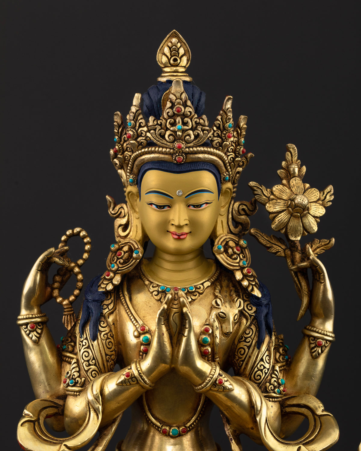 Close-up of Chenrezig Statue featuring ornate jewelry, semi-precious stone inlays, and detailed traditional Newari craftsmanship.