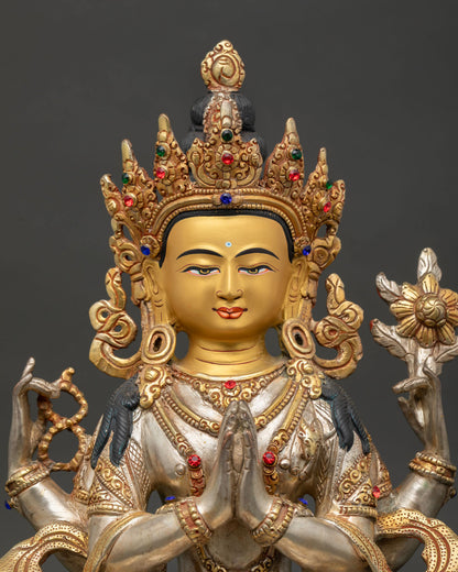 Close Up of Chenrezig Statue with Gold Painted Face and Semi Precious Stone Ornaments.