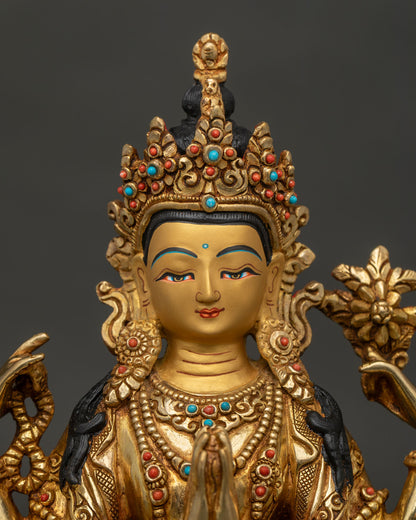 Close Up of Chenrezig Statue with Gold Painted Face and Semi Precious Stones