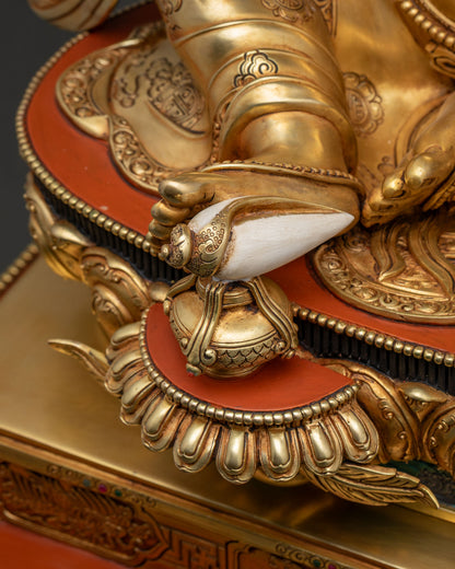 Close-up of conch shell resting on lotus base in Dzambhala Statue