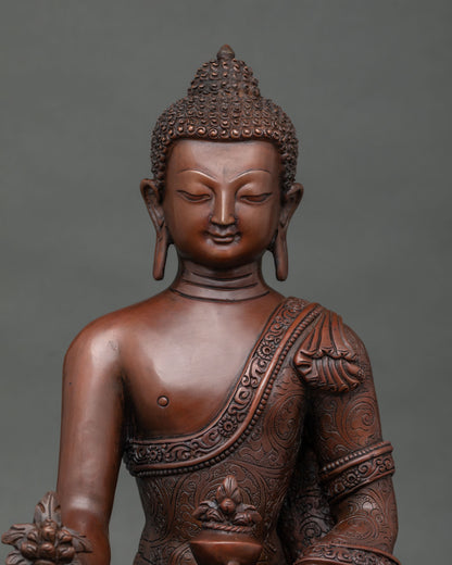 Close up of copper Medicine Buddha statue with brown patina and Newari craftsmanship from Nepal