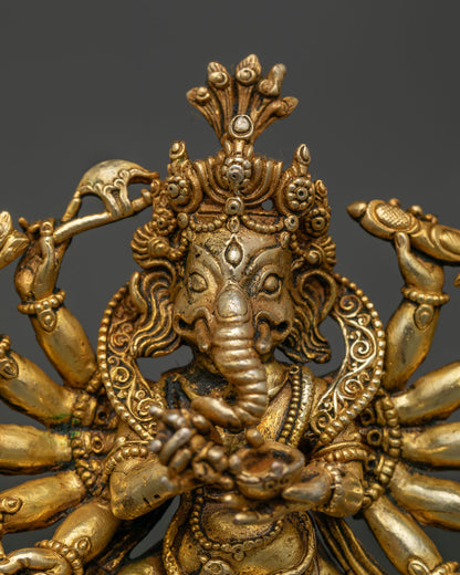 Close Up of Dancing Lord Ganesh with Twelve Arms and Sacred Ritual Objects.