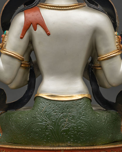 Close-up of deer skin draped over Chenrezig statue's shoulder, symbolizing compassion and renunciation