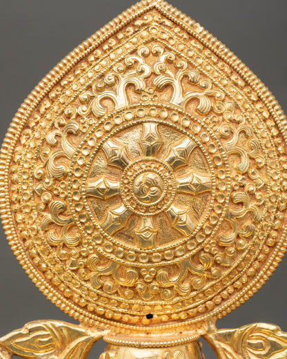 Close up of Dharma Wheel showing gold plated details and intricate design