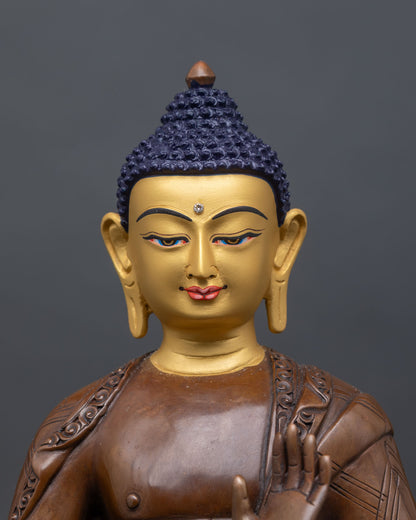 close-up of dipankara buddha face showing serene expression and gold-painted details