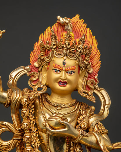 Close up of Dorje Phagmo deity statue showing gold painted face jewelry and sacred details