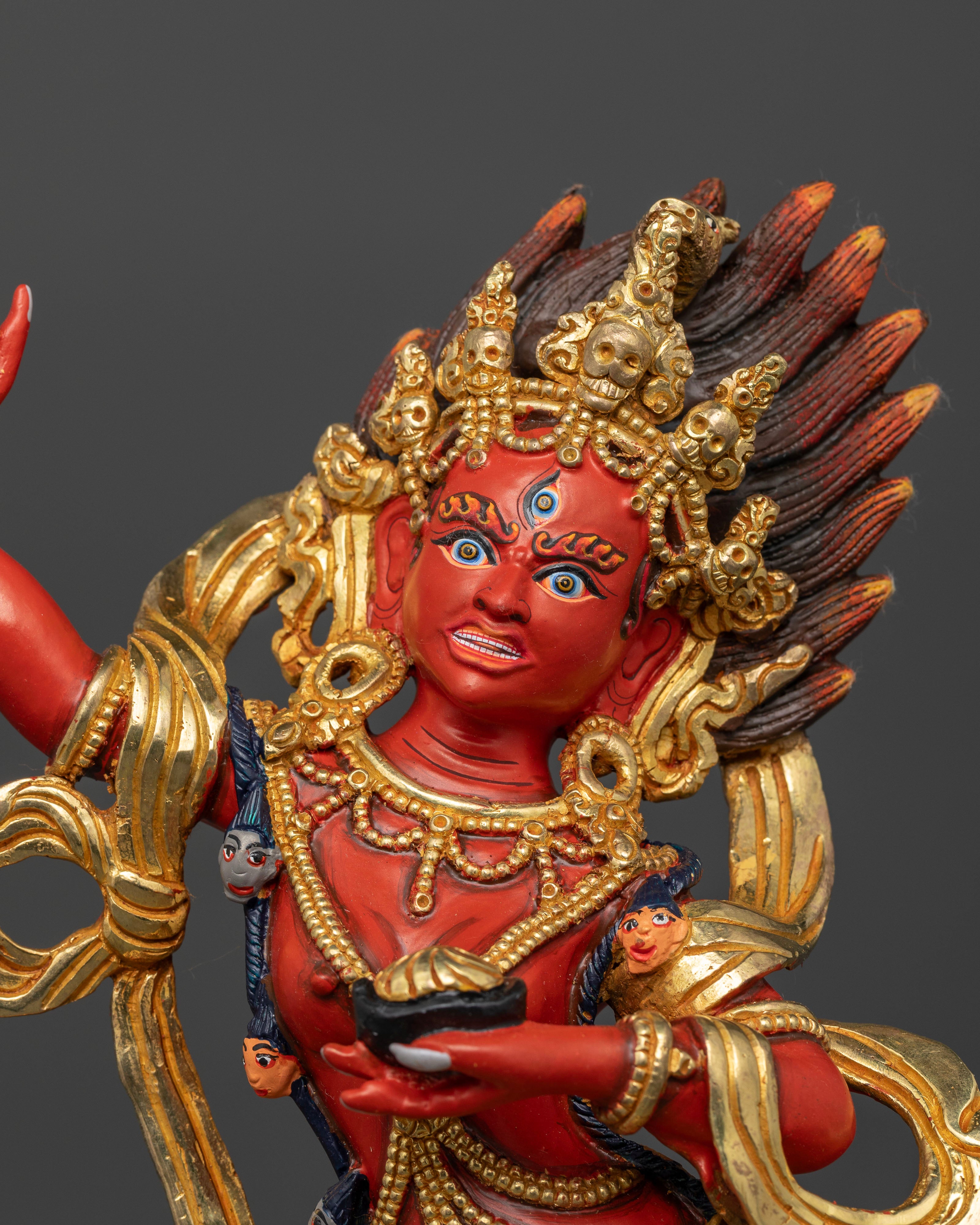 Close up of Dorje Phagmo showing fierce expression, skull cup, and curved ritual knife