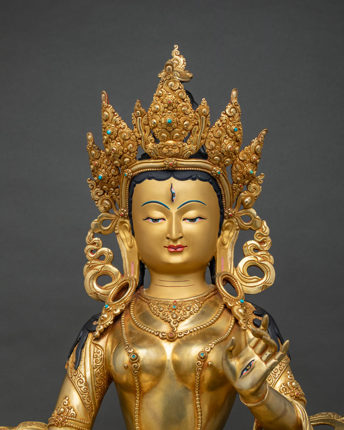 Close up of Dukar Sitatapatra statue showing gold gilded ornaments and crown, Nepal
