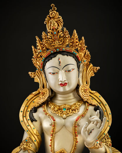 Close-up of Dukar statue face with gold-gilded crown and gemstone-inlaid diadem Nepal