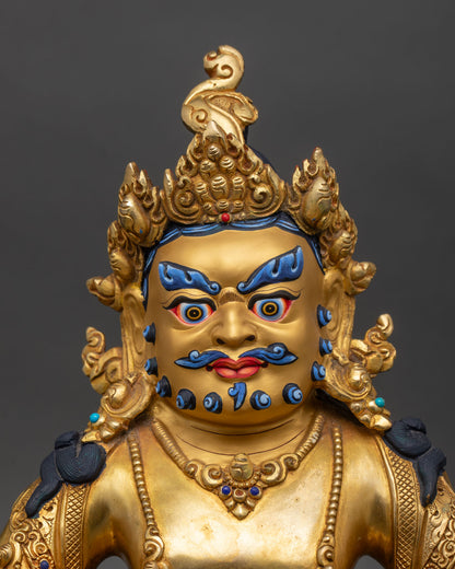 Close up of Dzambhala statue jeweled crown necklaces detailed engraving