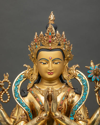 Close up of four-armed Chenrezig Avalokiteshvara statue in anjali mudra on lotus throne