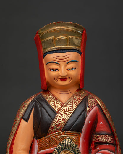 Close up of Gampopa statue holding a flaming jewel, handcrafted in Nepal from copper