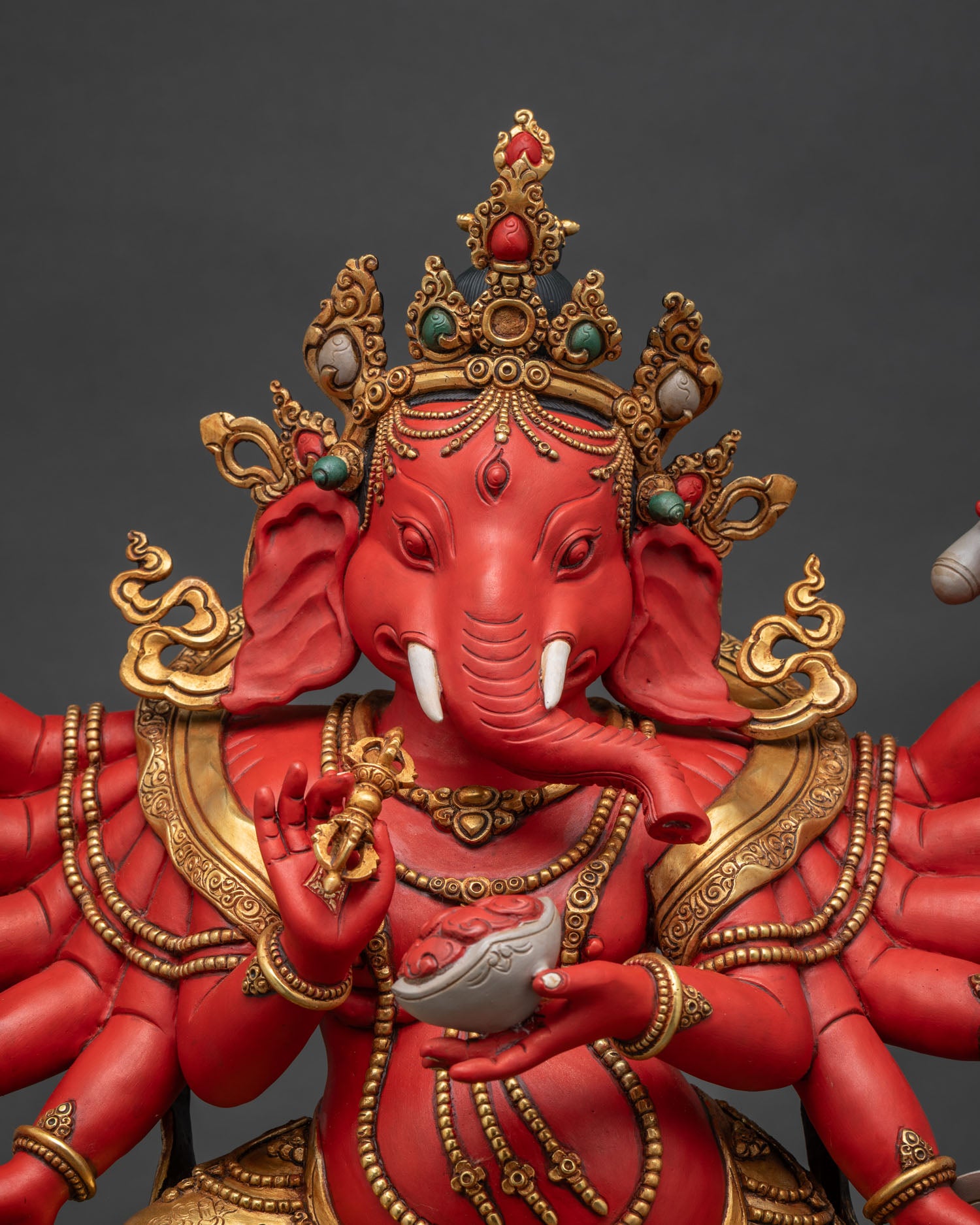 Close-Up of Ganapati Idol Showing Ornate Jewelry and Vibrant Colors
