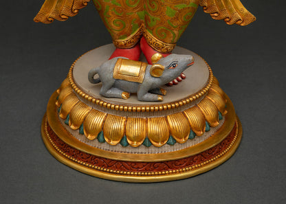 Close-up of Ganesha statue lotus pedestal base with Mushika mouse figure