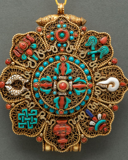 Close-up of Ghau Mala with Double Vajra and Eight Auspicious Symbols in turquoise and red coral