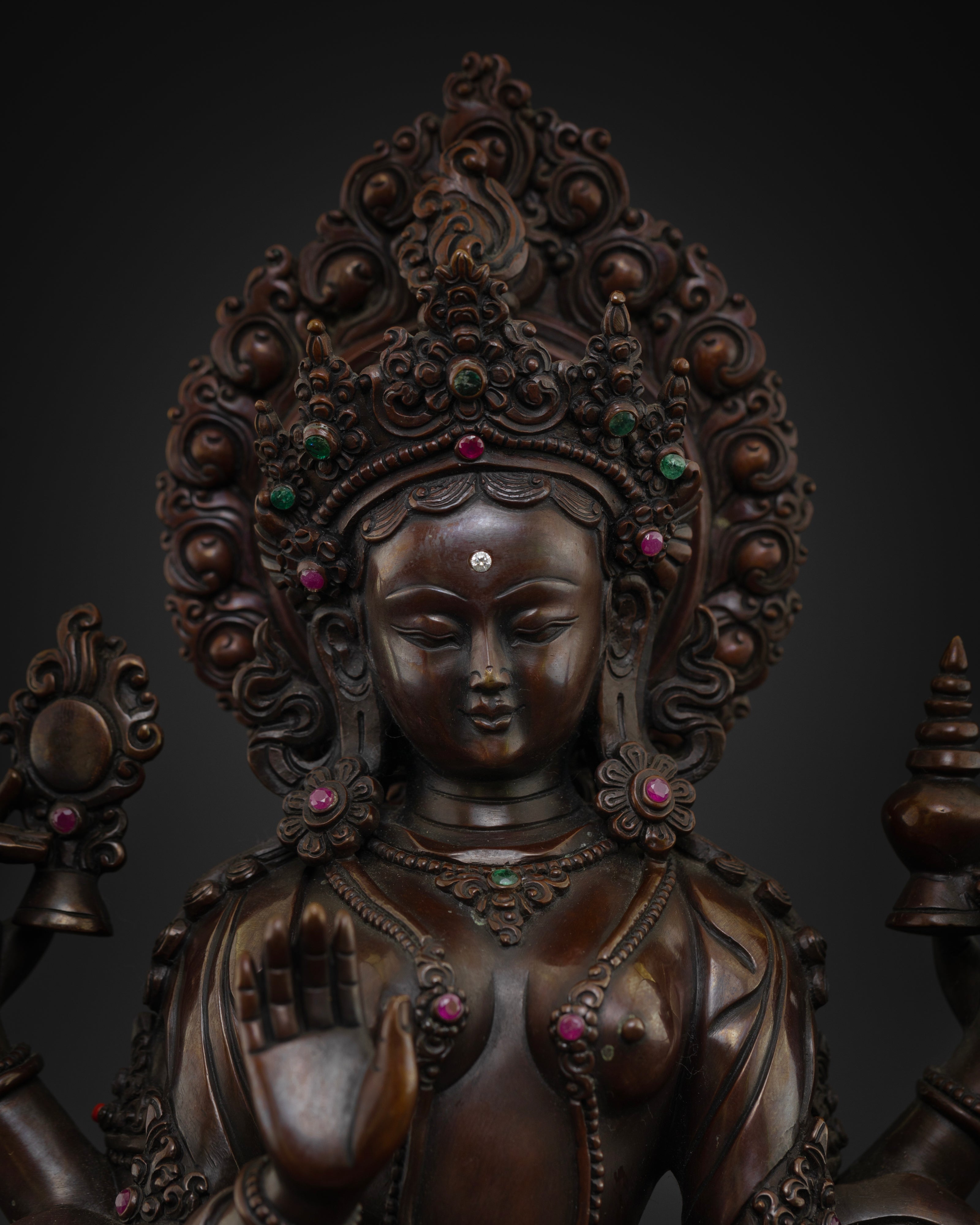 Close-up of Goddess Lakshmi with a serene expression, jewel inlays, intricate crown, and traditional Newari craftsmanship