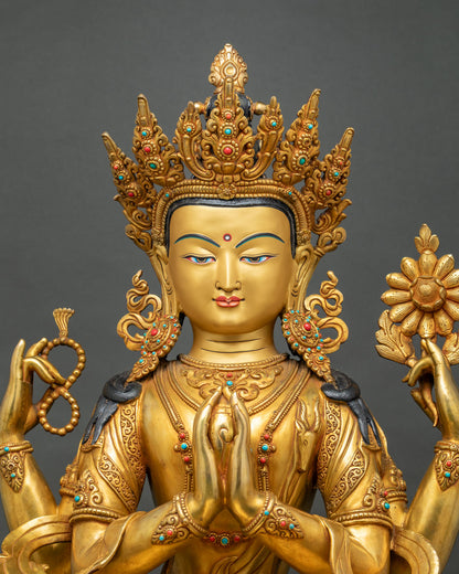Close-up of gold Chenrezig statue with ornate five-jeweled crown and serene painted face