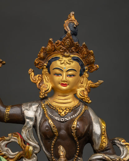 Close-up of gold-gilded Tsheringma statue with lotus throne & snow lion