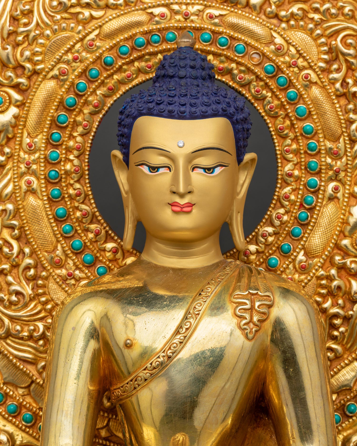 Close-up of gold Shakyamuni Buddha statue, fire-gilded copper, lotus seat, intricate robe detailing Nepal