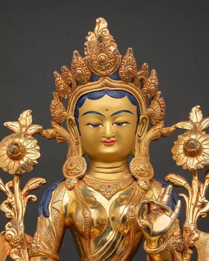 Close up of Green Tara Buddhist statue with semi precious stones and intricate Newari craftsmanship