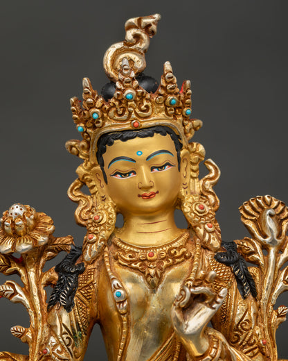 Close up of Green Tara goddess face with serene expression and semi precious stone detailing