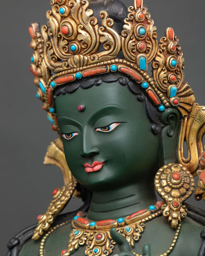 Close-up of Green Tara Statue adorned with semi-precious stones and hand-painted details