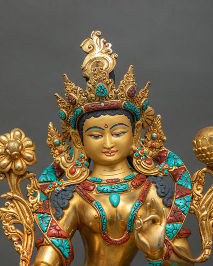 Close up of Green Tara statue bust, crown and halo in gold gilded copper, hand-carved in Nepal