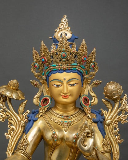 Close-up of Green Tara statue face and jeweled crown with turquoise and coral inlay