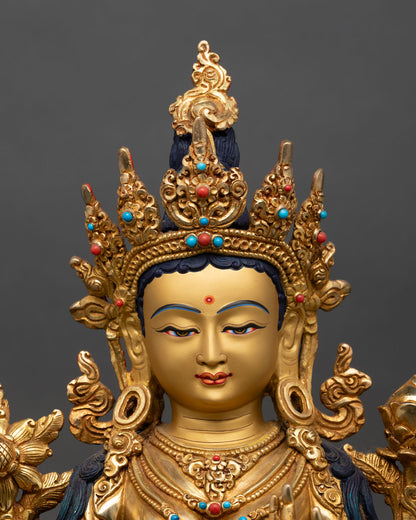 Close up of Green Tara statue gold painted face intricate details copper