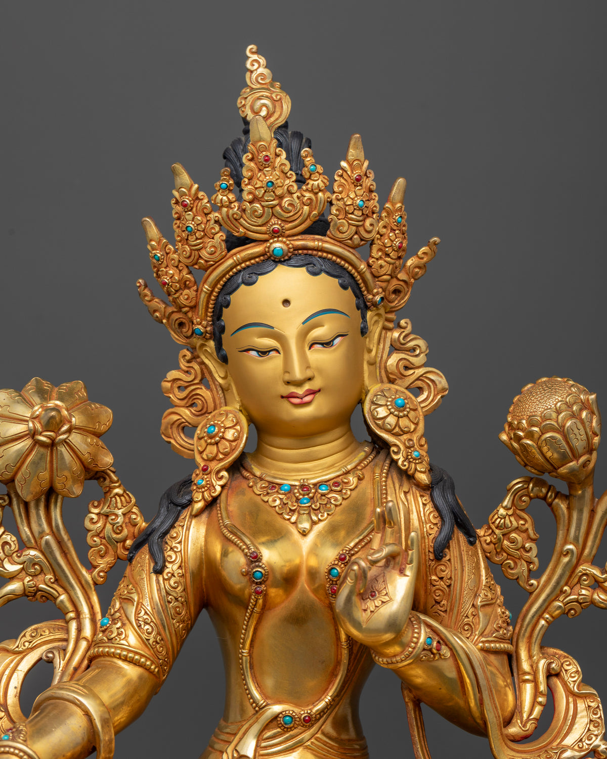 Close up of Green Tara Statue showing gold fire gilded copper craftsmanship