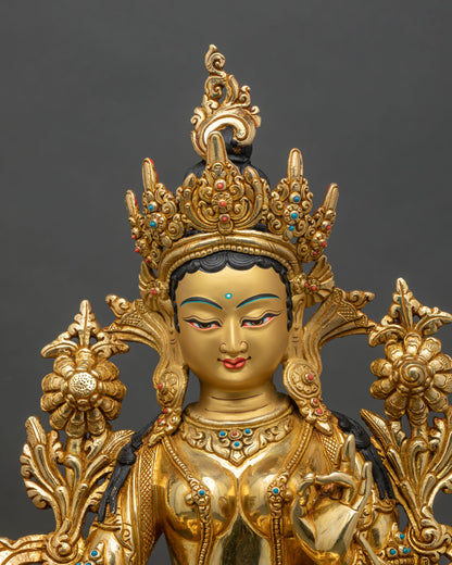 Close-up of Green Tara statue showing gold gilding and intricate lotus details