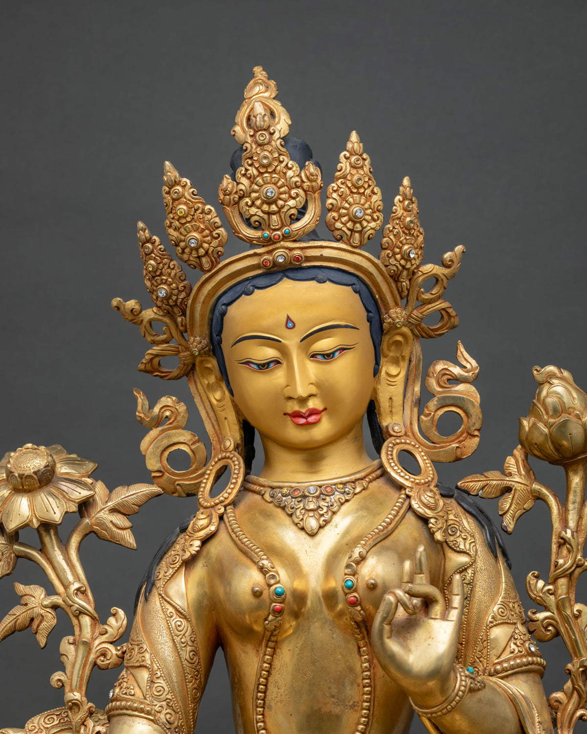 Close-up of Green Tara Statue showing gold gilding and turquoise coral inlay details