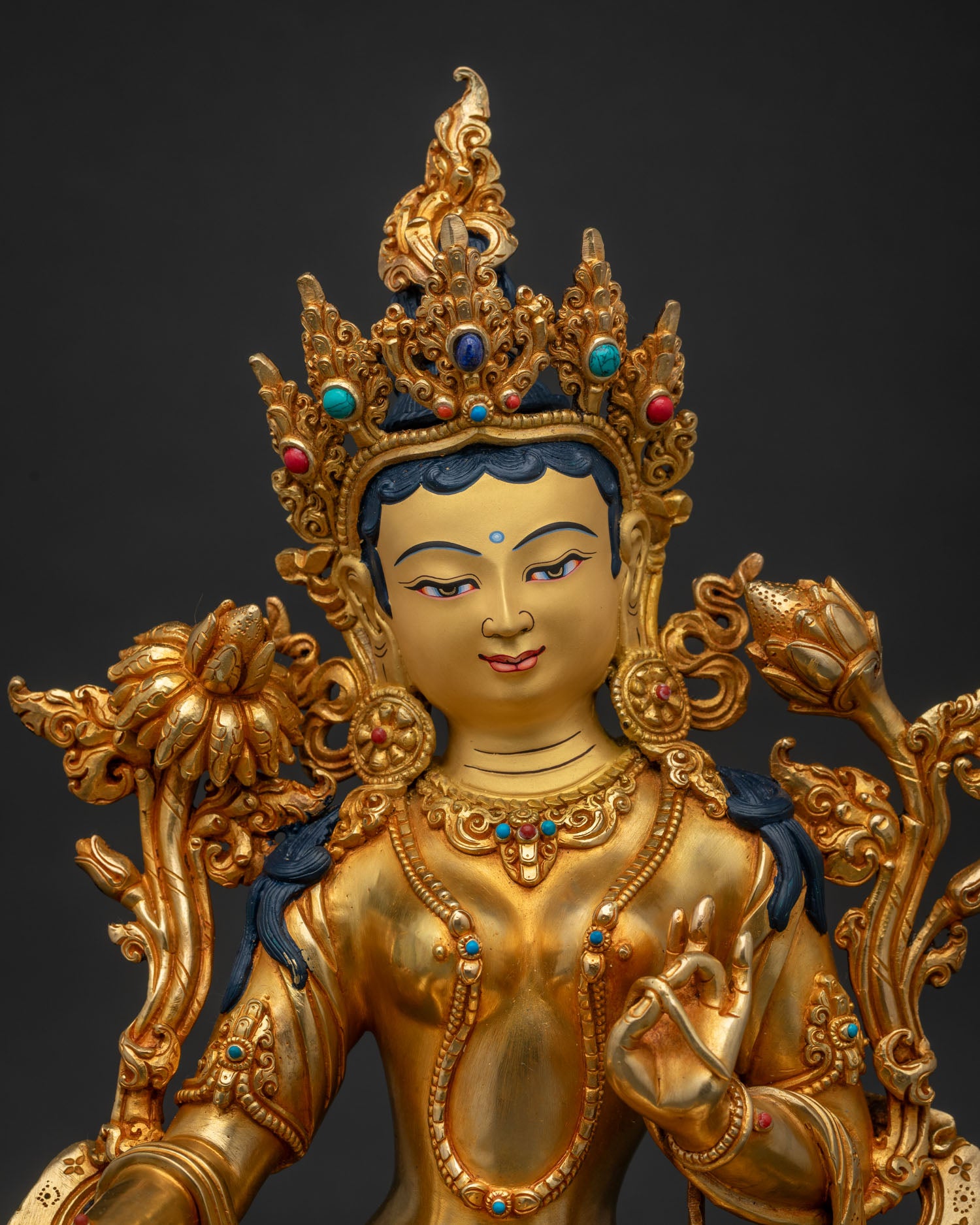 Close-up of Green Tara Statue showing intricate gold fire-gilded detailing and crown