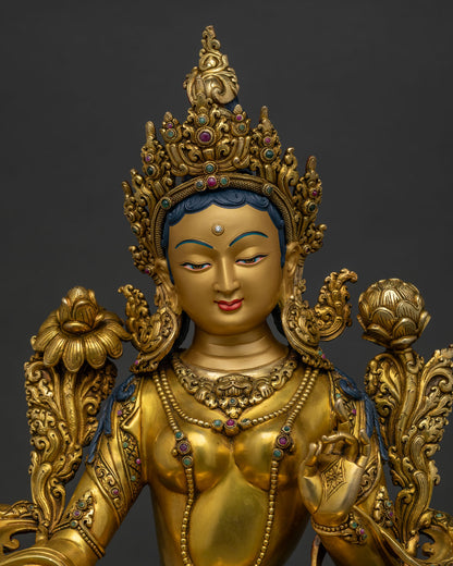 Close up of Green Tara Statue with 24K gold fire gilding and turquoise stone inlays