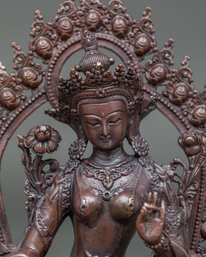 Close-up of Green Tara Statue with Varada Mudra, Utpala Lotus and oxidized finish