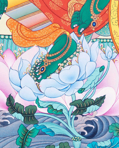 Close-up of Green Tara Thangka print in royal ease posture placing foot on lotus emerging from pond