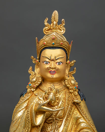 Close Up of Guru Norla Statue with Gold Painted Face, Lotus Hat and Vulture Feather