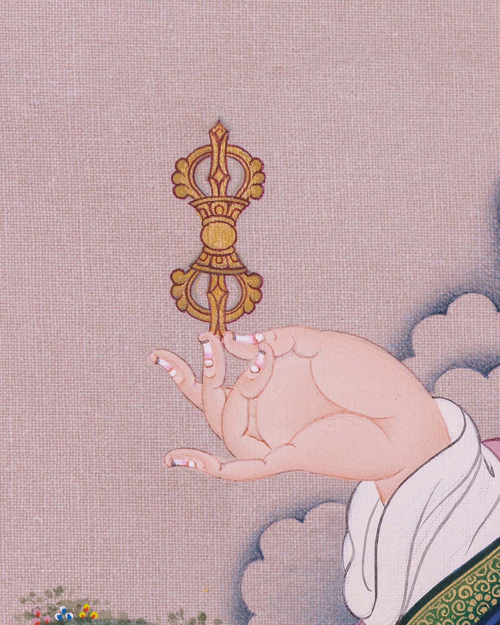 Close-up of Guru Rinpoche holding five-pronged vajra in traditional Buddhist thangka canvas print