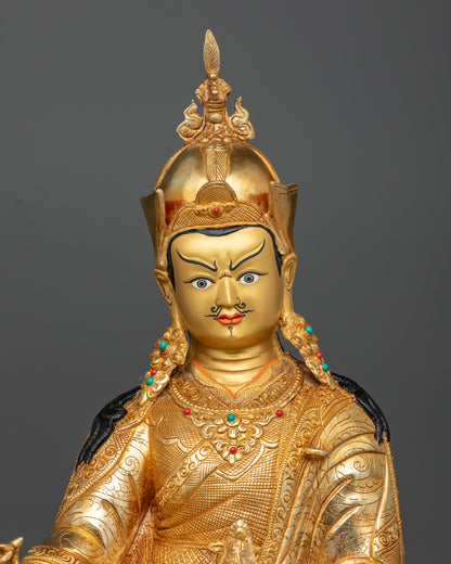 Close Up of Guru Rinpoche Statue with Gold Painted Face and Semi Precious Stones