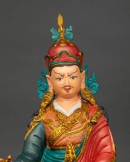 Close up of Guru Rinpoche statue with vajra and skull cup, copper Padmasambhava from Nepal