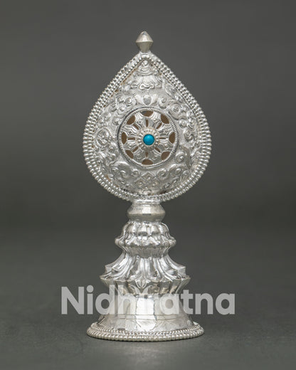 Close-Up of Hand-Carved Silver Norbu Finial with Turquoise Stone and Openwork Dharma Wheel