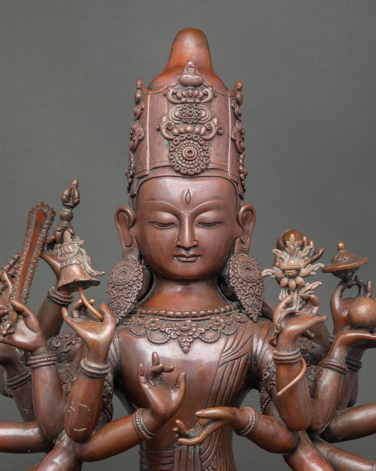 Close-up of hand-cast copper Chundi Juntei Kannon statue, Himalayan Buddhist craftsmanship