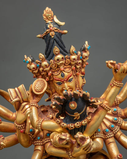 Close up of handcrafted Chakrasamvara Yab-Yum statue with skull crown and twelve arms