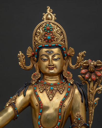 Close-up of handcrafted copper Indra statue featuring 24K gold gilding and inlaid stones